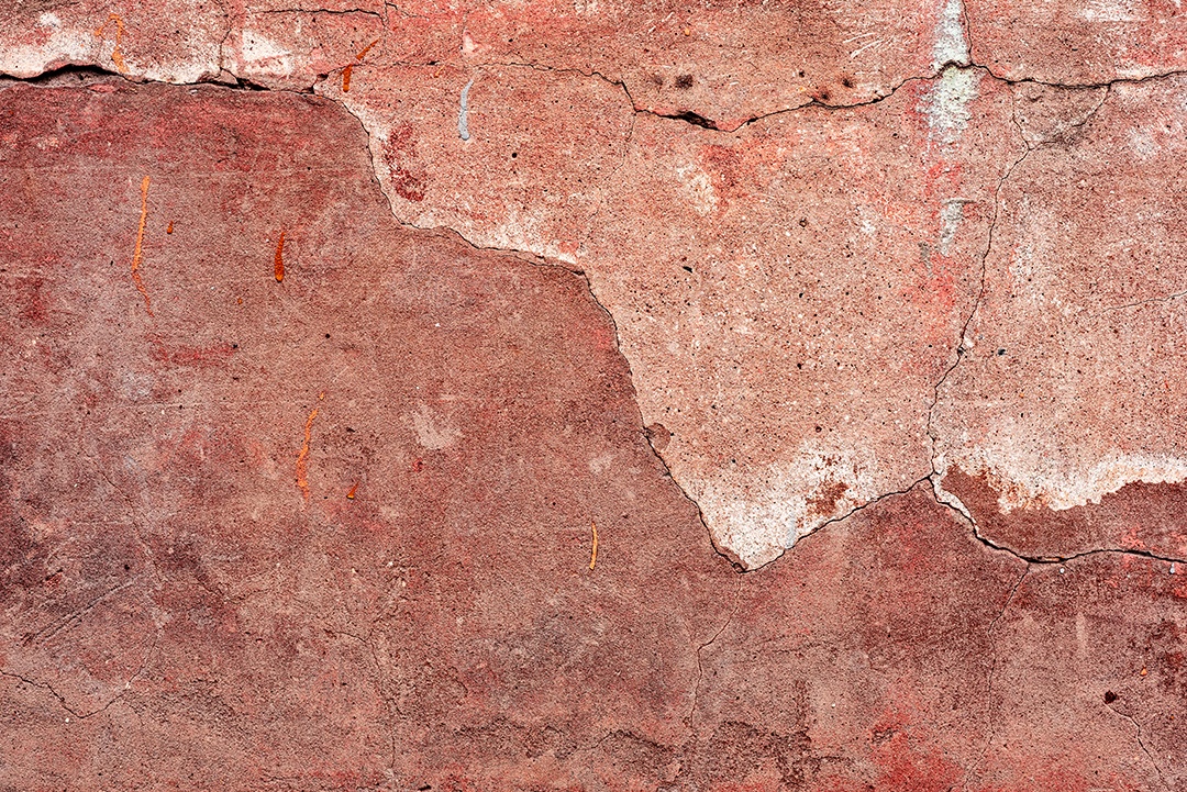 Textura, parede, concreto, pode ser usado como fundo. Fragmento de parede com arranhões e rachaduras