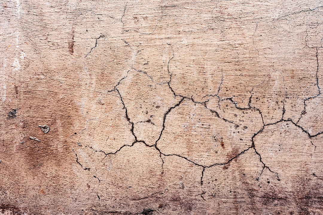 Textura, parede, concreto, pode ser usado como fundo. Fragmento de parede com arranhões e rachaduras