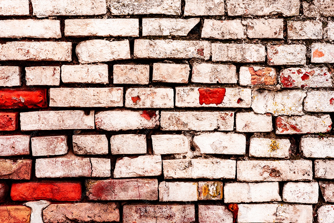 Textura de uma parede de tijolos com rachaduras e arranhões que podem ser usadas como fundo