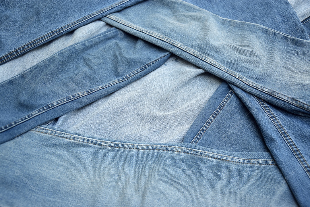 Pernas de calças costurada jeans