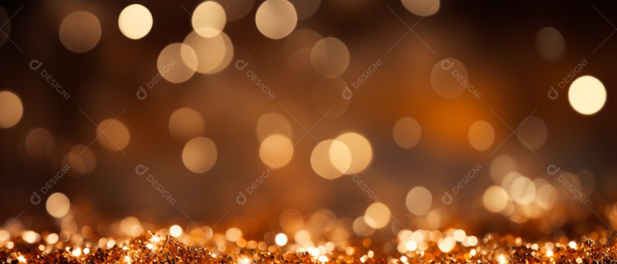 Partículas douradas de Natal e granulados para uma celebração de feriado como Natal ou ano novo. luzes douradas brilhantes.