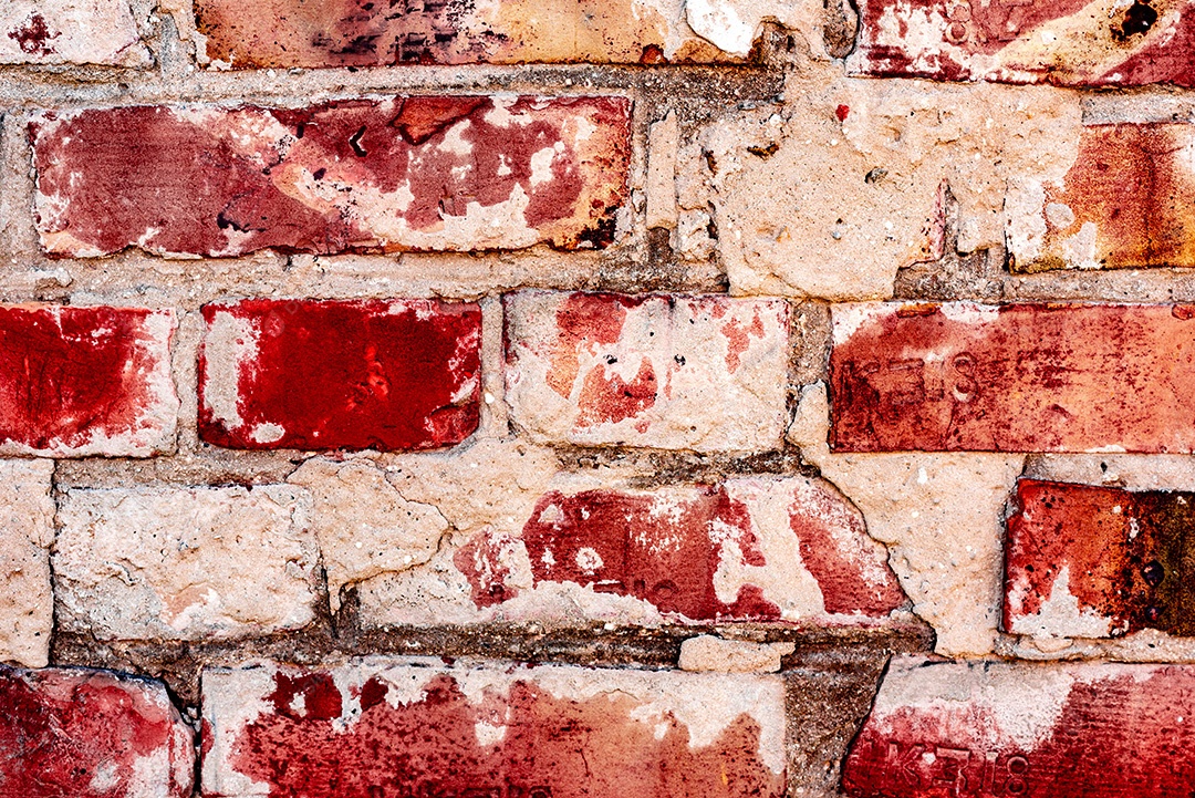 Textura, parede, concreto, pode ser usado como fundo. Fragmento de parede com arranhões e rachaduras