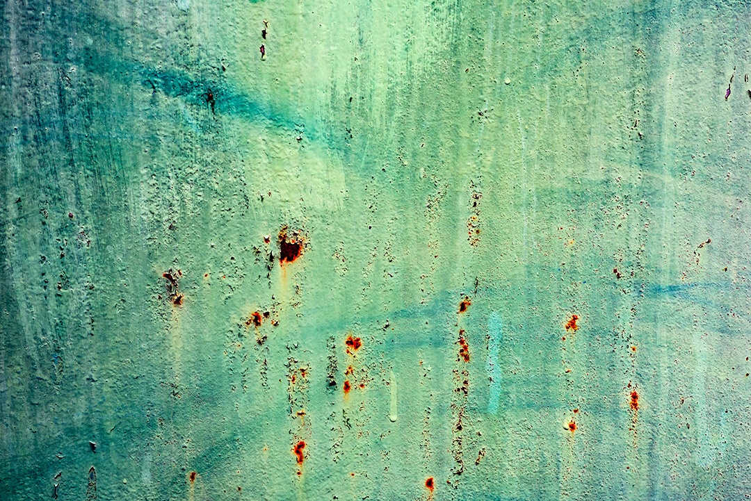 Textura de uma parede metálica com rachaduras e arranhões que podem ser usadas como fundo