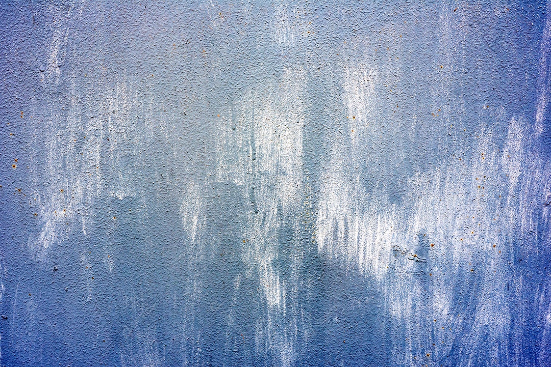 Textura de uma parede metálica com rachaduras e arranhões que podem ser usadas como fundo