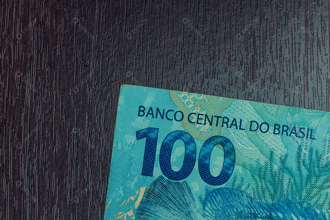 Closeup em dinheiro brasileiro de 100 notas imagem conceitual da economia do brasil