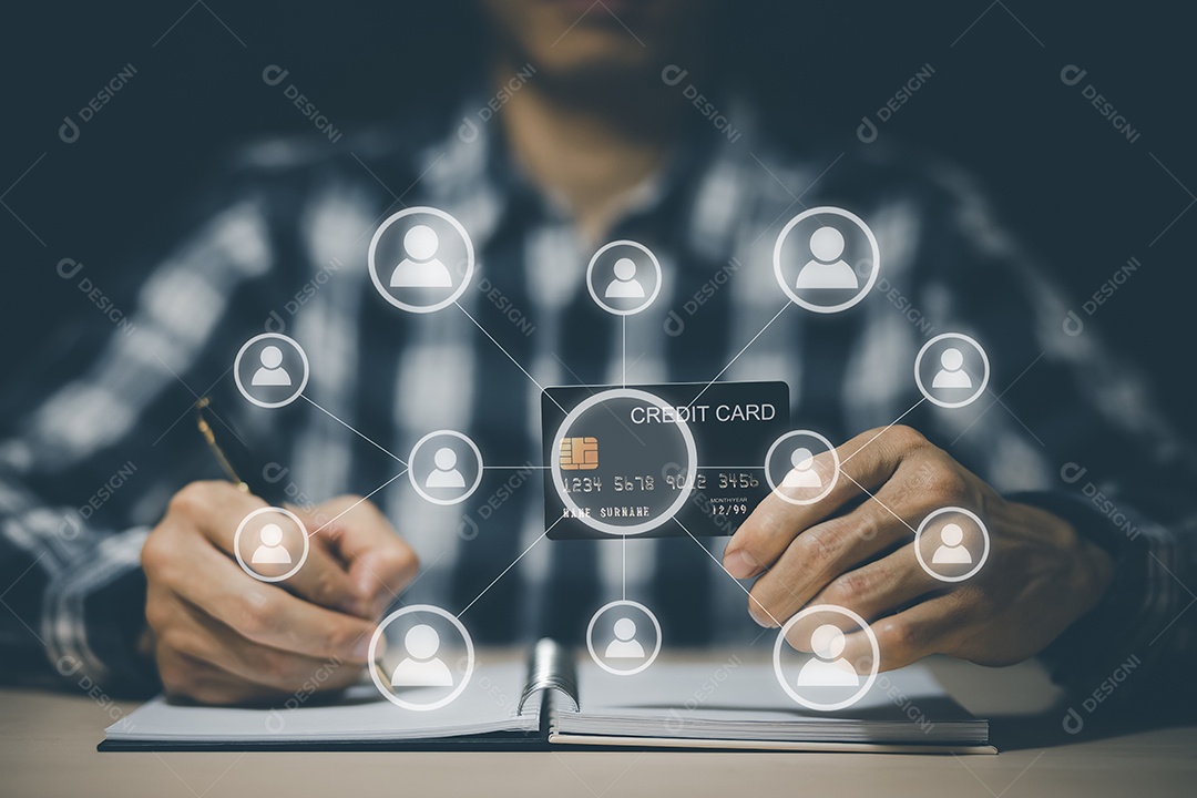 Empresário segurando cartão de crédito para fazer uma compra na Internet no computador portátil com um cartão de crédito IA