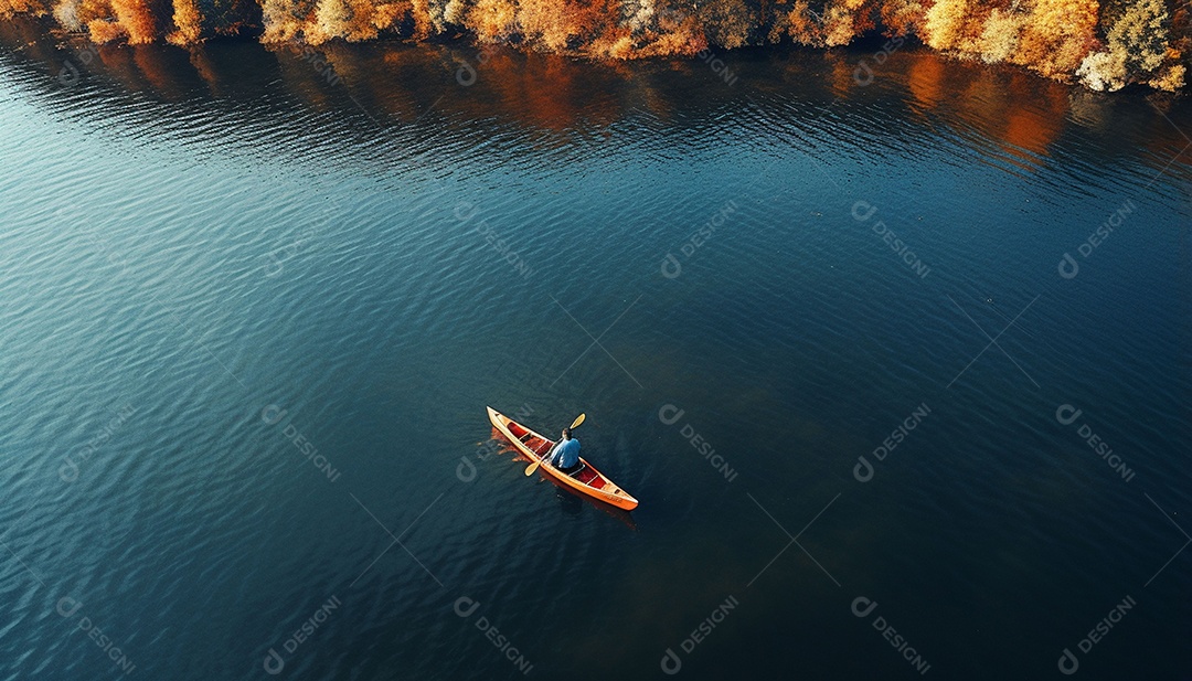 Pessoa remando em um lago calmo em vista aérea de outono
