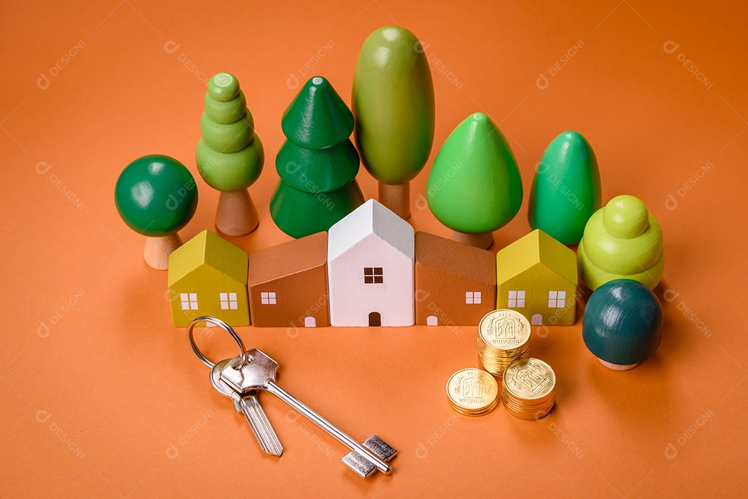 Uma casinha de madeira e chaves como ideia para investir na casa própria e atingir o objetivo de comprar um imóvel. Plano de fundo para sua ideia