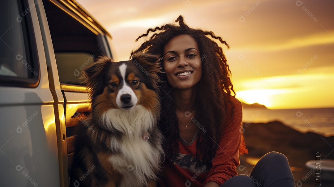 Mulher jovem e cachorro sentados na frente de sua van