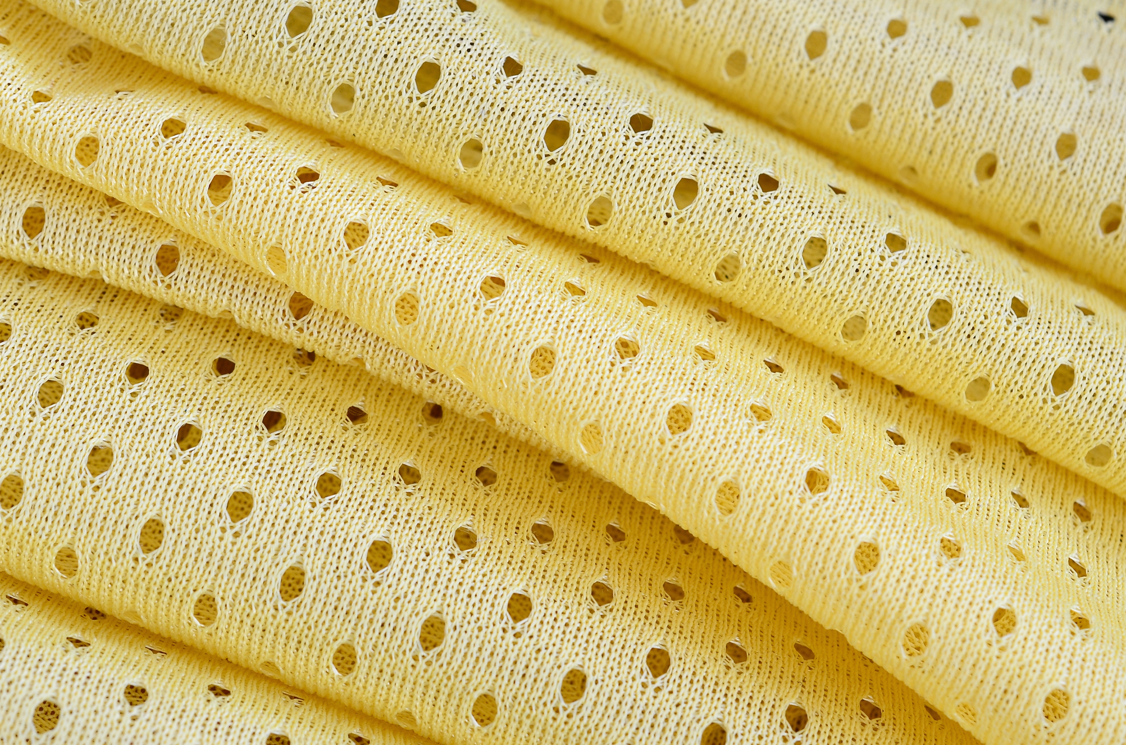 Textura de tecido desgaste esportivo de malha amarela