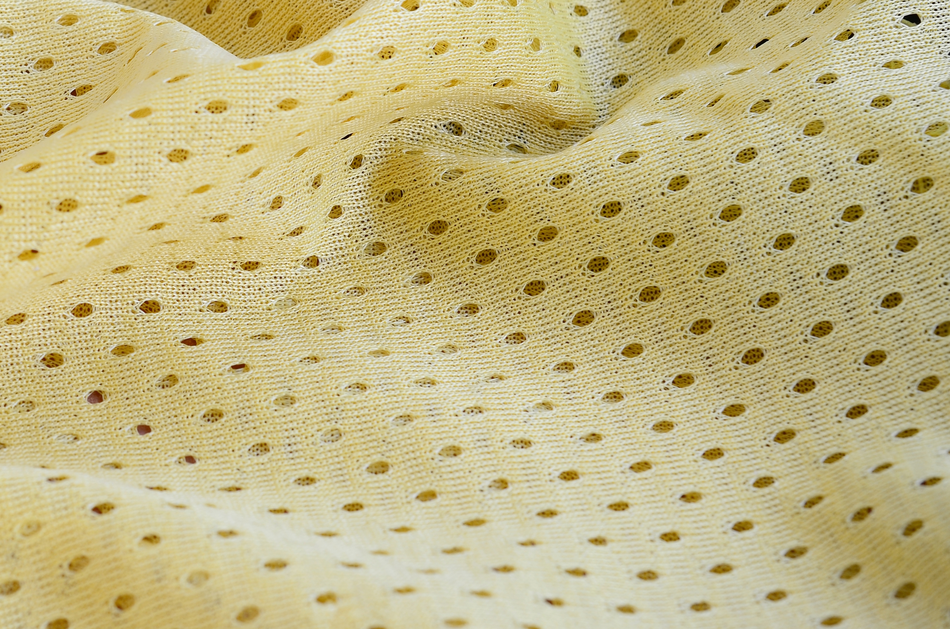 Padrão de fundo têxtil de tecido de desgaste esportivo de malha amarela