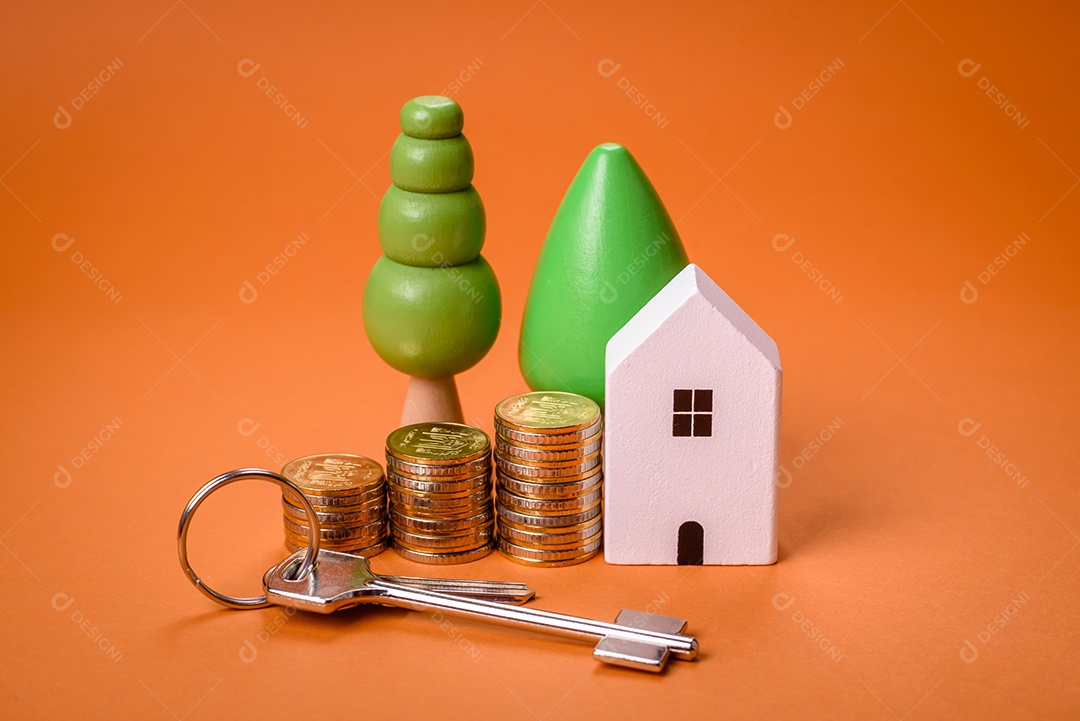 Uma casinha de madeira e chaves como ideia para investir na casa própria e atingir o objetivo de comprar um imóvel. Plano de fundo para sua ideia