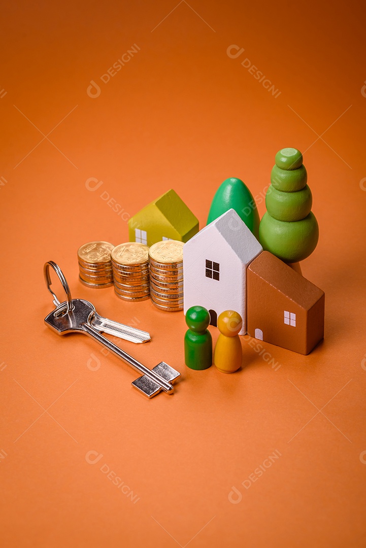 Uma casinha de madeira e chaves como ideia para investir na casa própria e atingir o objetivo de comprar um imóvel. Plano de fundo para sua ideia