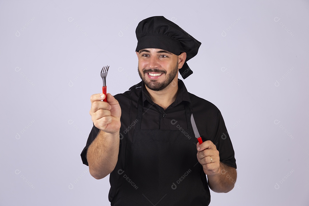 Homem jovem cozinheiro sobre fundo isolado