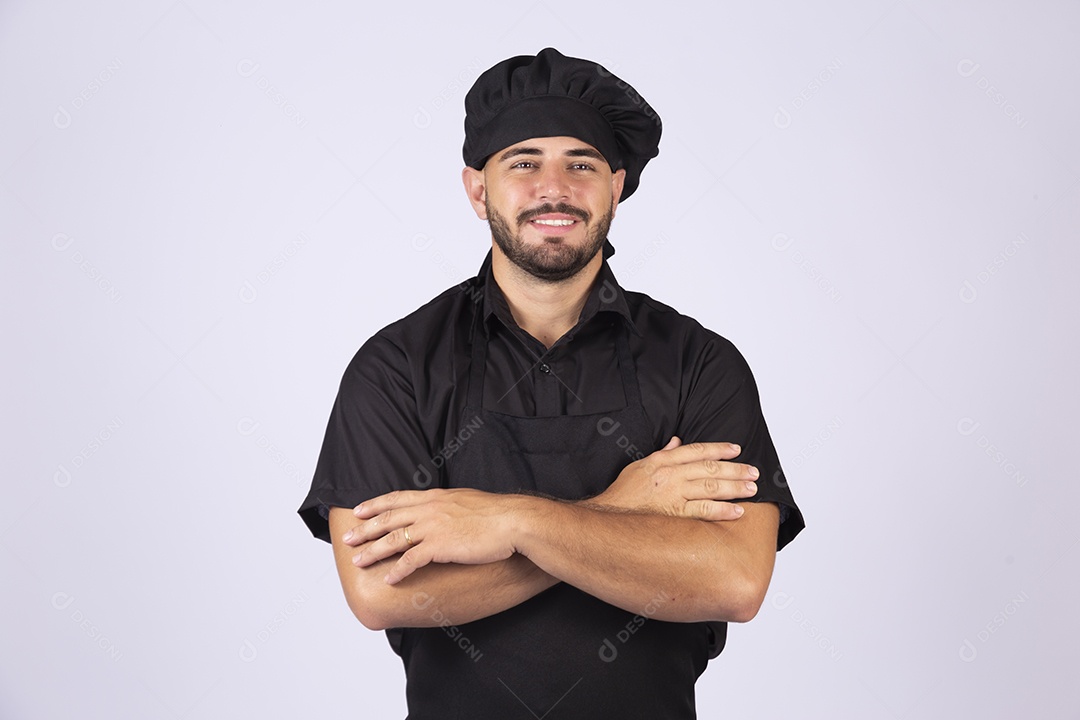 Homem jovem cozinheiro sobre fundo isolado