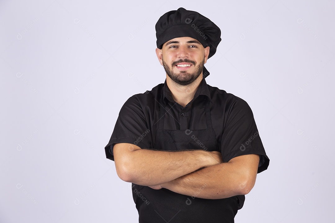 Homem jovem cozinheiro sobre fundo isolado