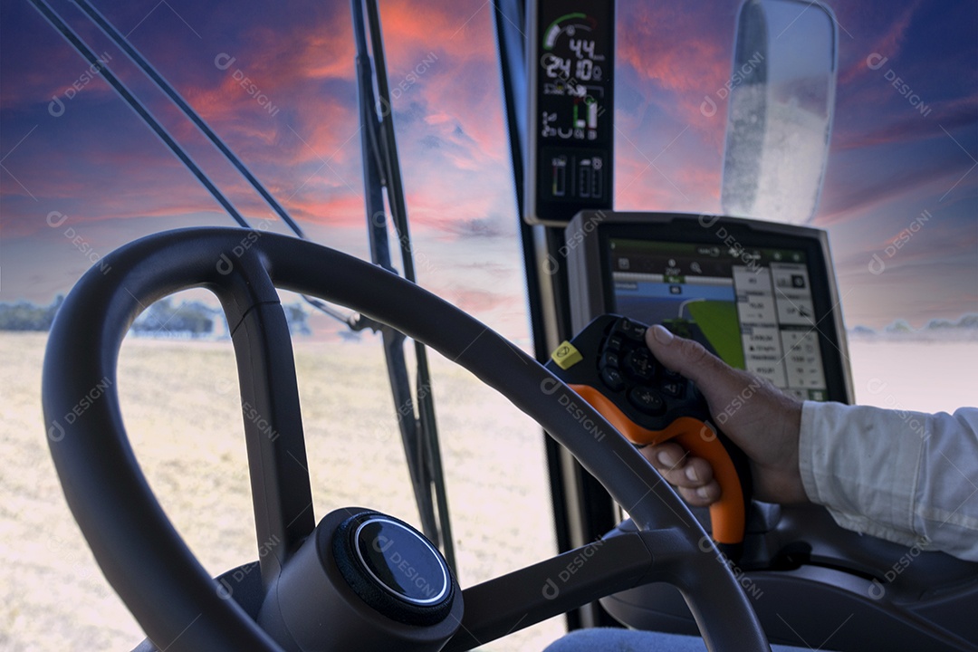 Vista de dentro da cabine de trator na colheita