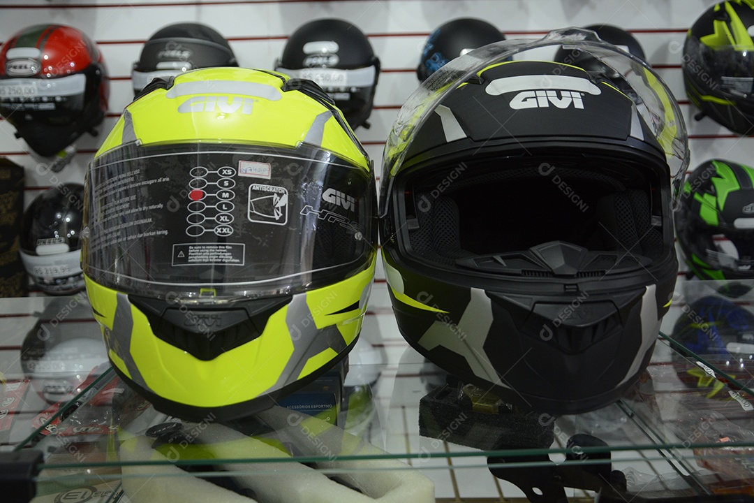 Helmets on a yellow and other black color showcase