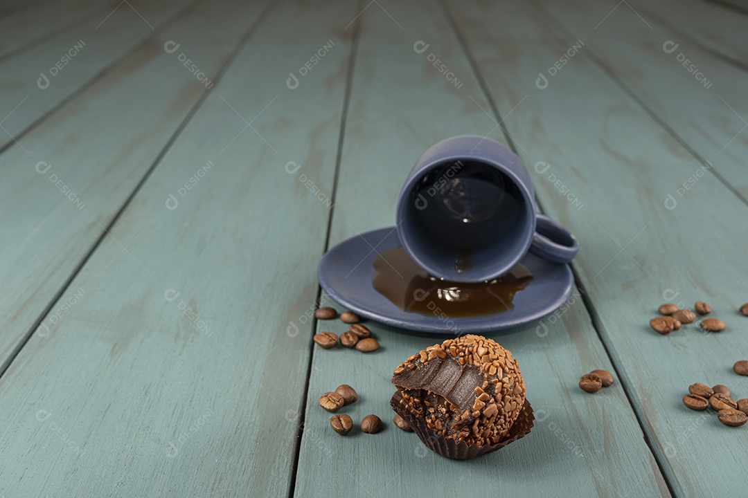 Delicious Brigadier with cup of coffee in the background