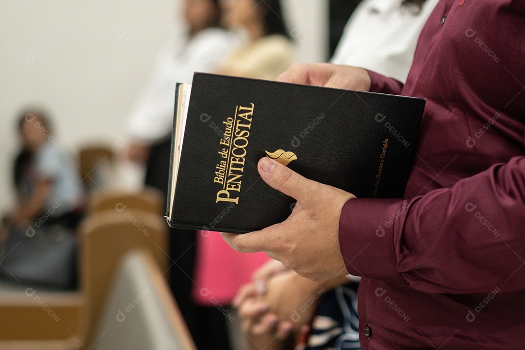 Man with Bible in hand in a church