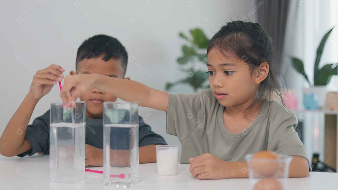 Two children doing science experiment with water