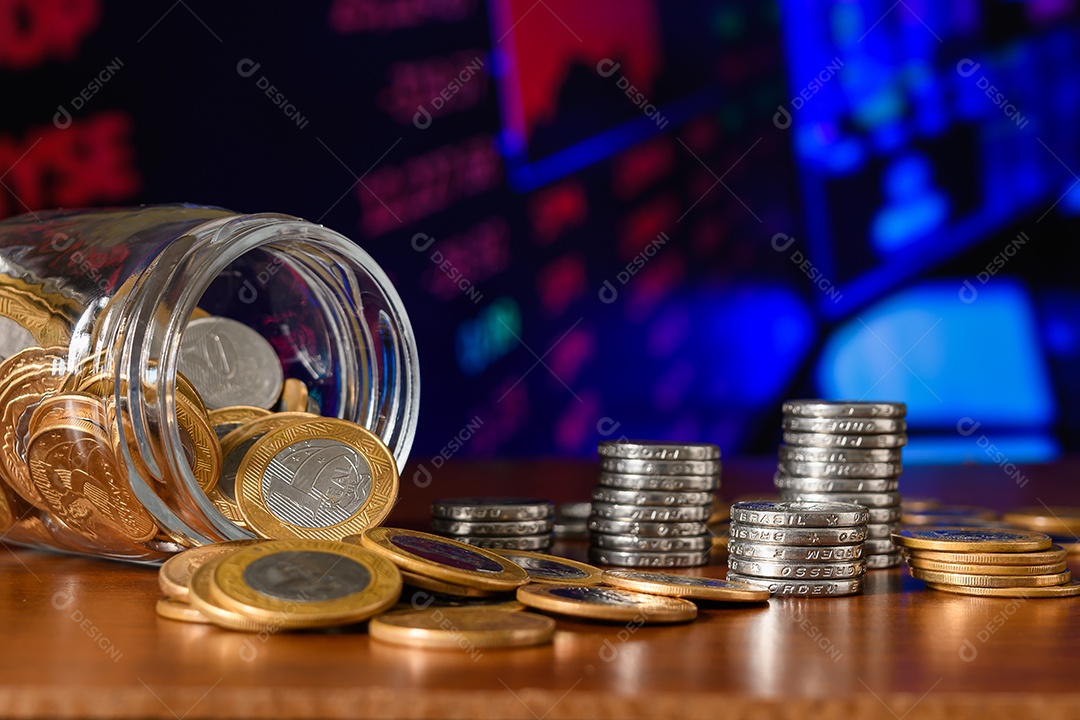 Glass pot with many coins