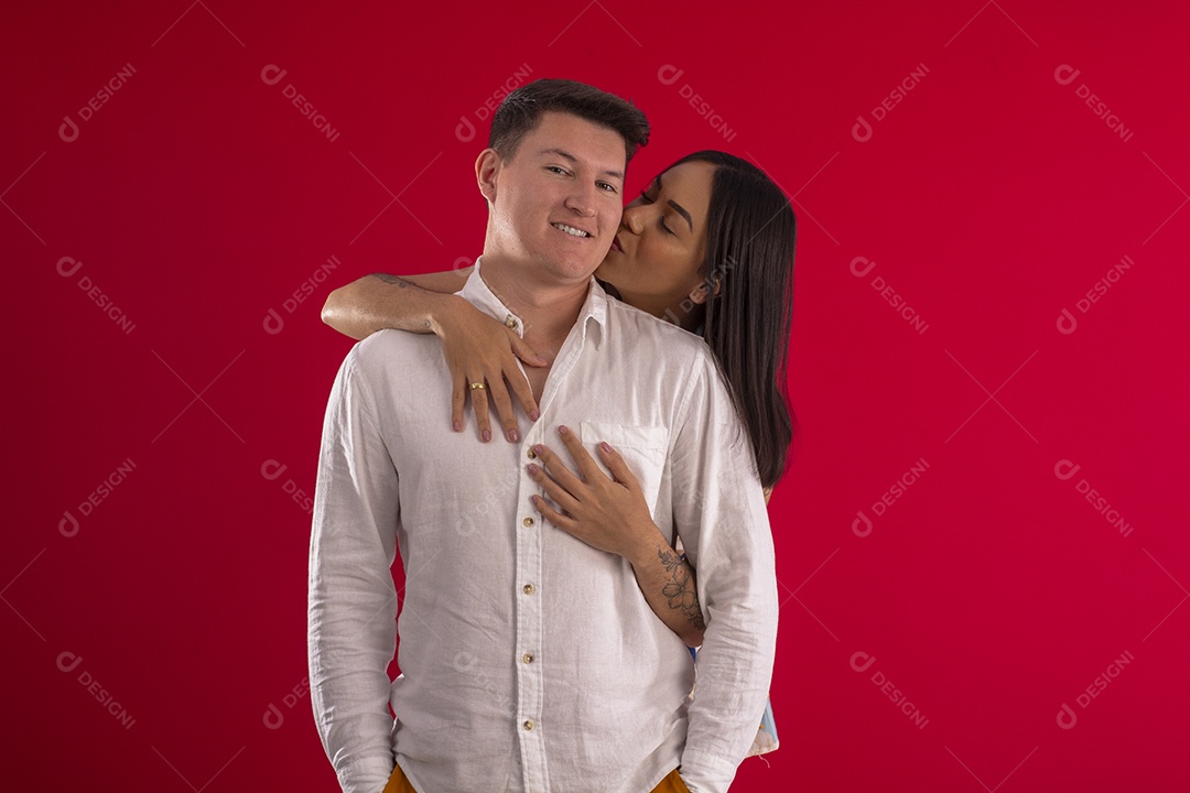 Woman hugging her husband for studio photos