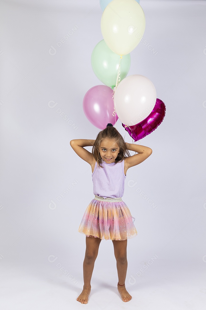 Beautiful little girl celebrating birthday with her balloons