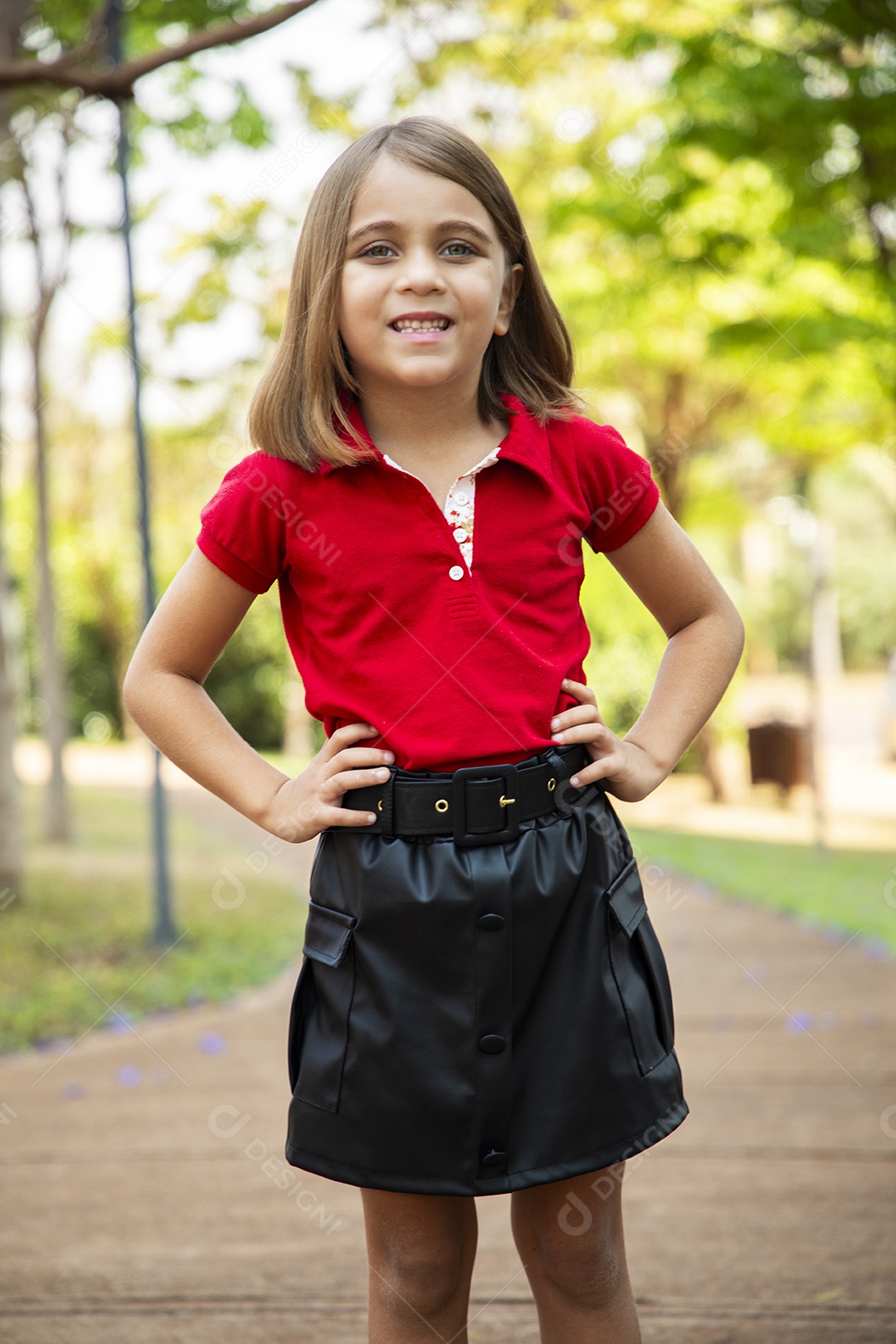 A beautiful girl smiling with hands on the waist