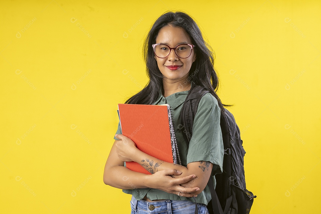 Happy girl with books and notebooks backpack on the back
