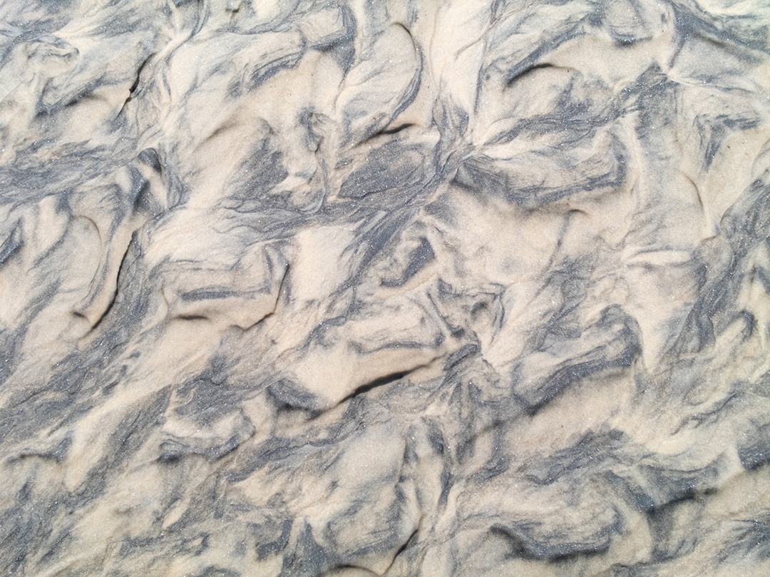 Textura de areia molhada com fundo natural de ondulações