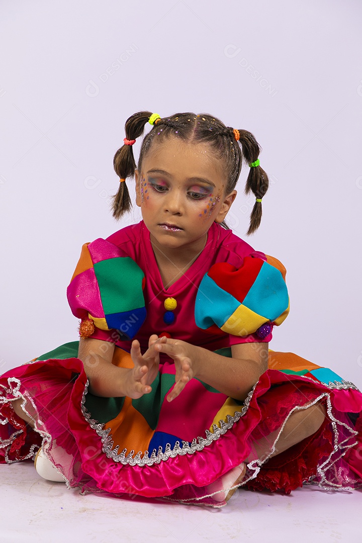 Cute girl with colorful dress and sad face