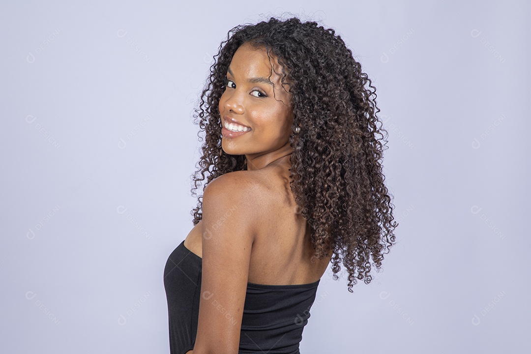 Beautiful young brunette of curly hair