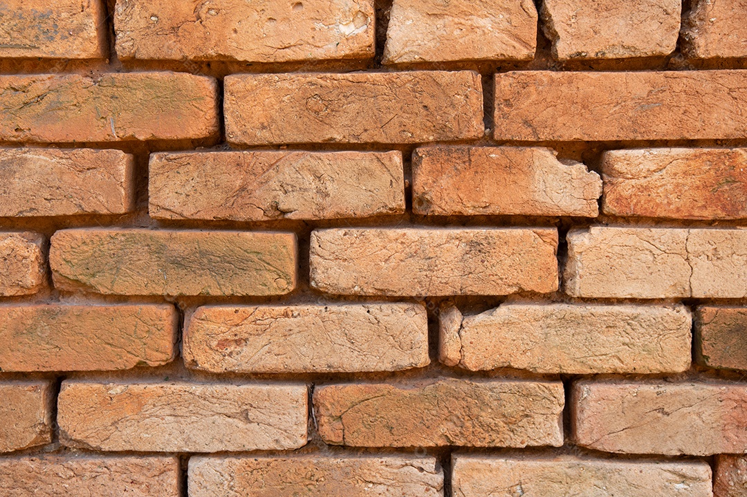 Fundo de parede de tijolos de barro laranja velho