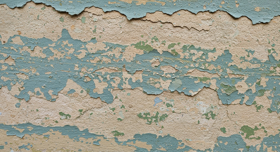 Textura de uma parede com tinta descascando.