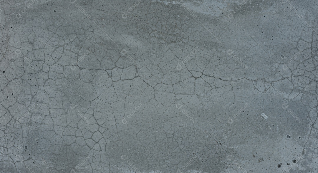 Textura de uma superfície de concreto com fissuras.