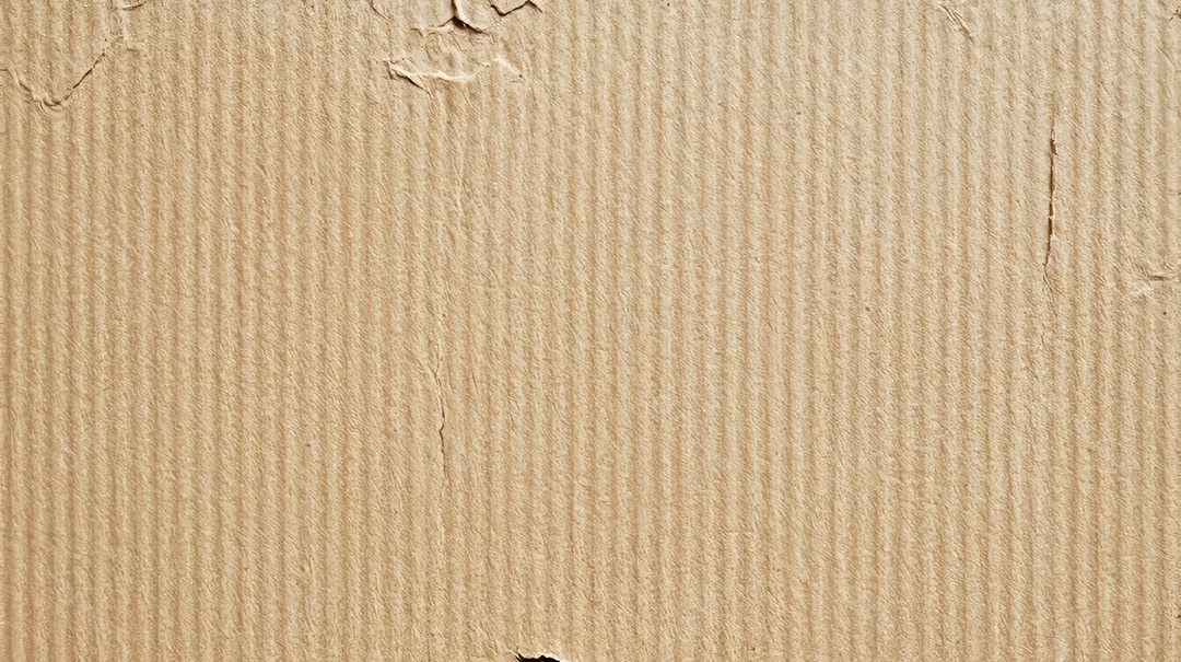 Textura de uma superfície de um papelão ondulado.